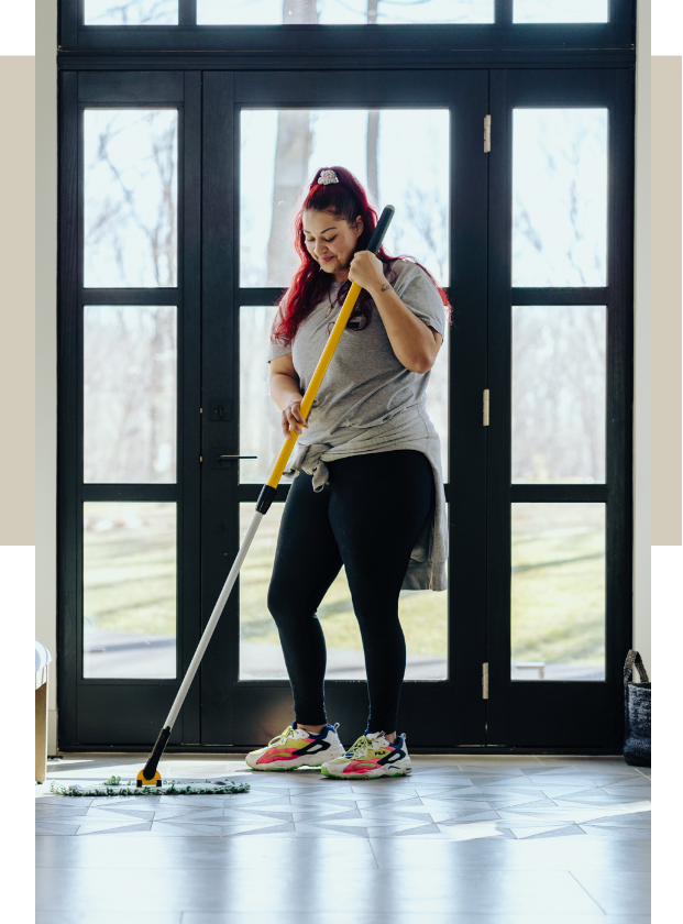 employee cleaning a foyer